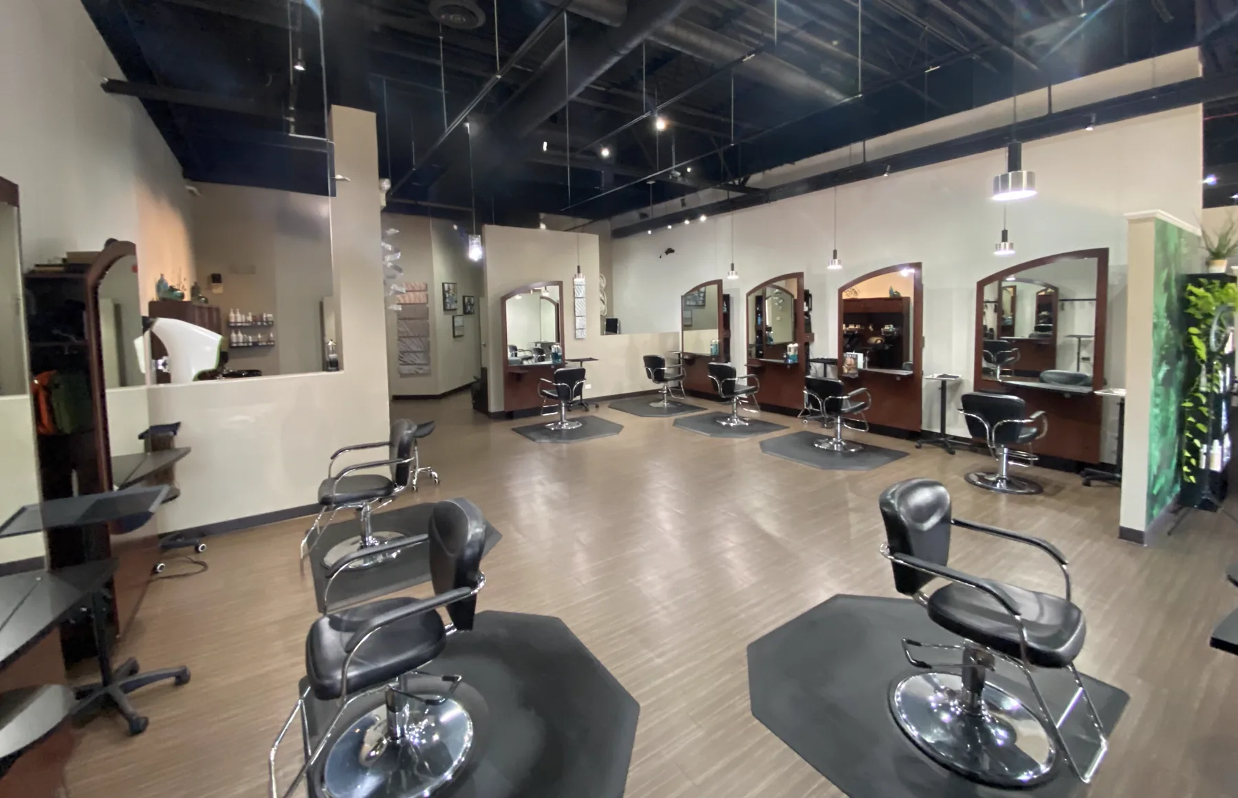 A wide view across the Neo Bella Salon styling floor