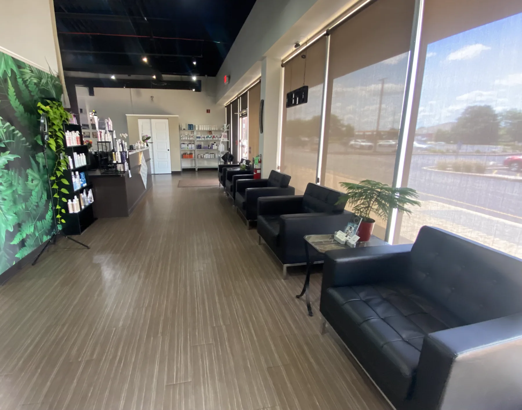 The waiting area and product shelves at Neo Bella Salon