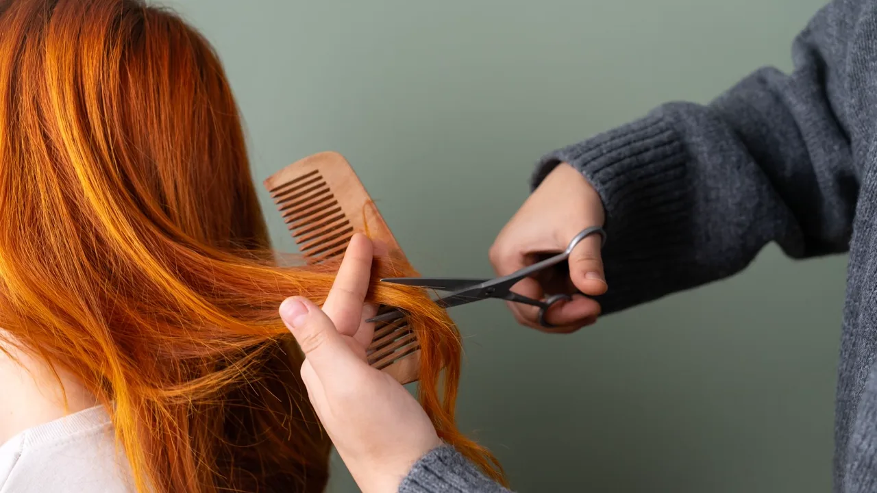 A precision haircut being shaped with scissors